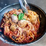 meatballs in a skillet with tomato sauce