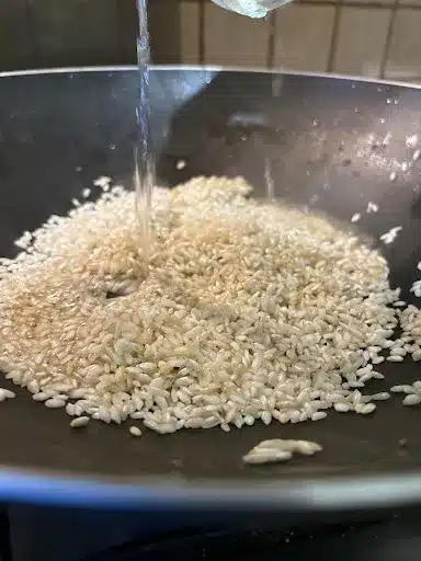 Pouring the wine on the rice