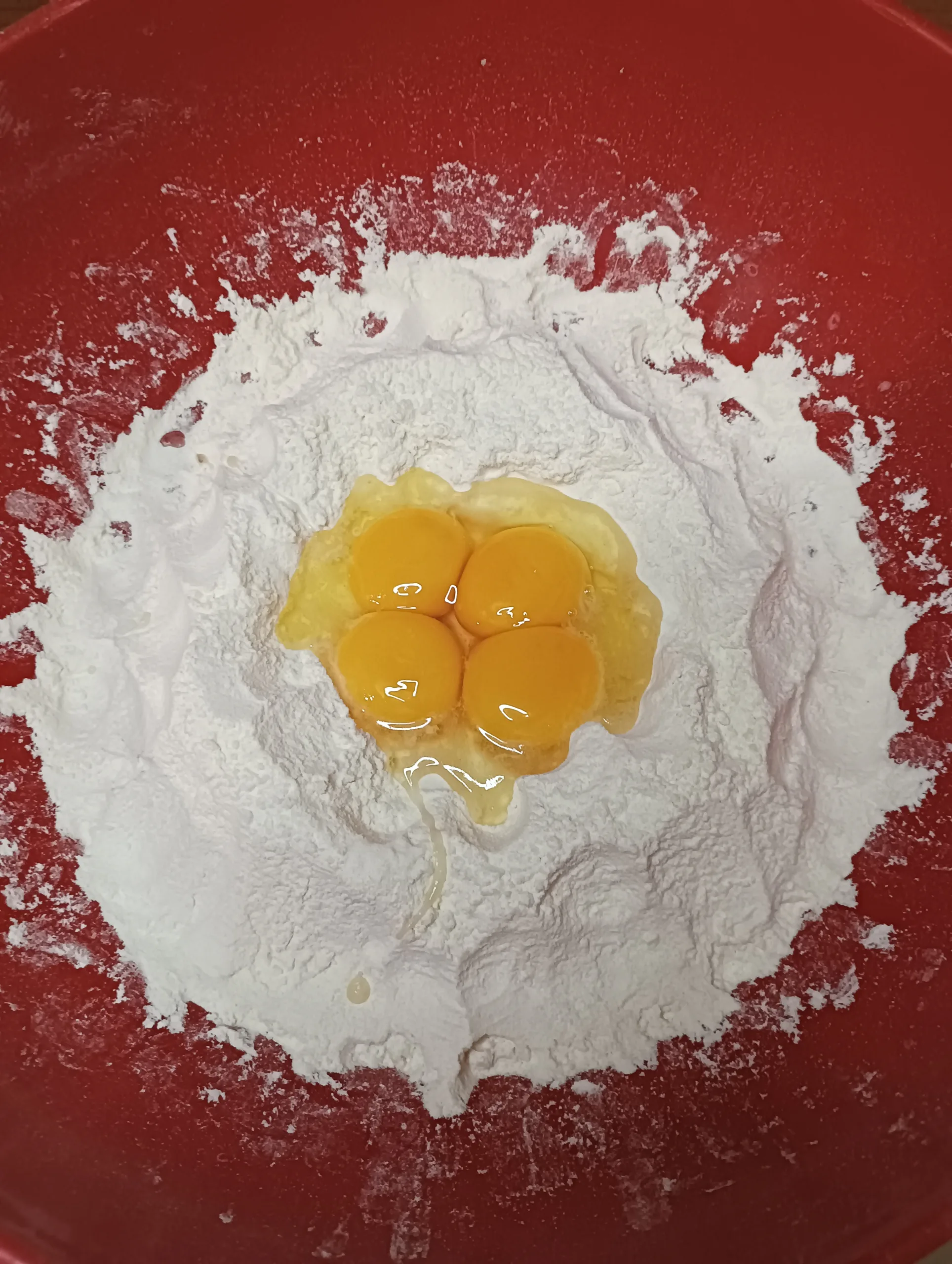 mound flour with eggs